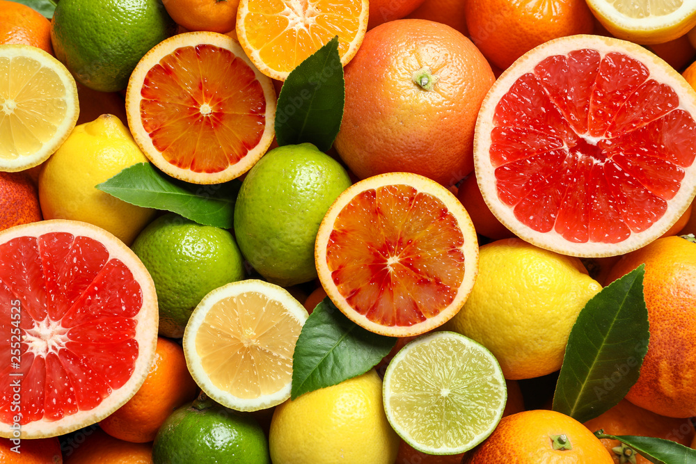 Different citrus fruits as background, top view - obrazy, fototapety, plakaty 