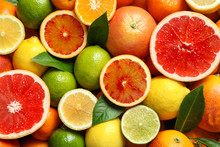 Different Citrus Fruits As Background, Top View