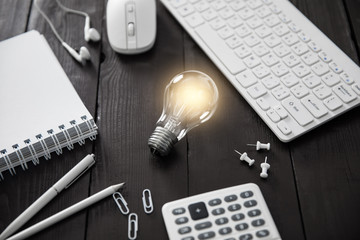 Canvas Print - light bulb on working desk