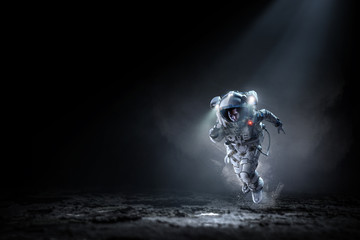 Wall Mural - Spaceman running fast. Mixed media