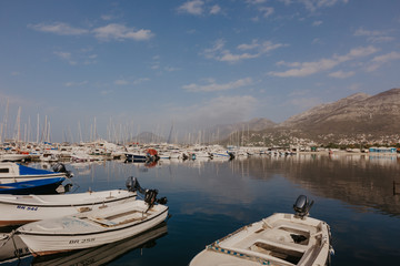 Bar, Montenegro - November 31, 2018. fishing boats on the background of mountains and yachts on the Adriatic coast. - Image.