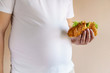 unhealthy fattening food, high-calorie snack, eating on the go, take-out meals. overweight man eating sandwich