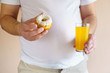 fattening food, high-calorie snack. weight loss, dietary, balanced nutrition. overweight man with unhealthy sweet products, cookie and carbonated drink