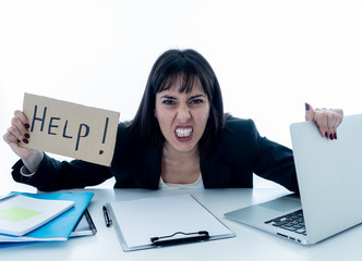 Young business woman stressed and desperate with laptop. Frustrating and stressful work environment