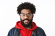 © Cookie Studio - Headshot of ambitious and handsome young creative african american freelancer with pierced nose and afro hairstyle in glasses smiling joyfully at camera as ordering in cafe, waiting for check