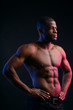 © alfa27 - Muscular man African bodybuilder. Man posing on a black background, shows his health and perfect shape.
