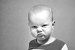 © Pavlo - Portrait of a funny boy who grimaces, black and white photo