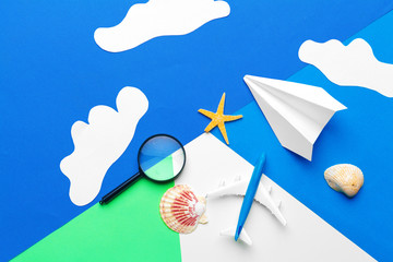 Wall Mural - Paper plane  on a blue background with clouds