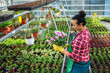 © Nejron Photo - Black woman working in a botanical garden