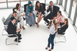 © InfiniteFlow - Businesswomen and businessmen attending group meeting conference in office room. Corporate business team concept.