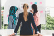 © InfiniteFlow - Multicultural working group. Team of businesswomen of different ethnicity, Caucasian, Asian and Arabic working together in team meeting at office. Multiethnic teamwork concept.