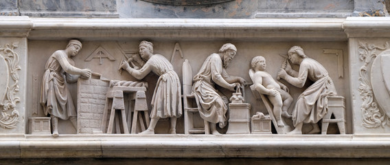 Wall Mural - Detail of the sculptors and architects at work, bas-relief (detail of the tabernacle of the Four Crowned Saints) by Nanni di Banco, in Orsanmichele Church in Florence, Italy