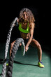 woman training crossfit with ropes