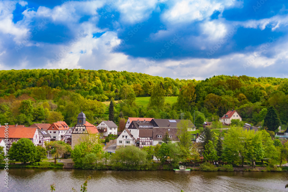 Beautiful landscape scenery of the small village Staufenberg in Lower Saxony,  Germany at the river Fulda