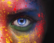 © Prostock-studio - Blue eye of woman looking at camera on black