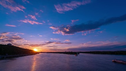Canvas Print - beautiful sunset over river dnepr in ukraine - time lapse footage. 4k. boats sailing while orange su