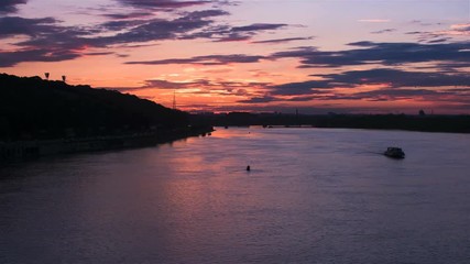 Canvas Print - beautiful sunset over river dnepr in ukraine - time lapse footage. 4k. boats sailing while orange su