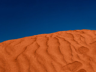 Wall Mural - red sand hill in the desert. ripples in the sand.