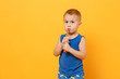 © ViDi Studio - Kid boy 3-4 years old in blue shirt brush his teeth with toothbrush isolated on bright yellow orange wall background, children studio portrait. People, childhood lifestyle concept. Mock up copy space.