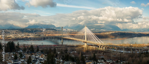 Cuadros en Lienzo Panoramic view of Port Mann going across Fraser River during a sunny winter day