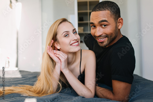 Portrait Cute Couple In Love Chilling On Bed In The Morning In