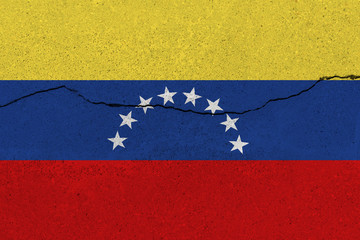 venezuela flag on concrete wall with crack