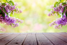 Lilac Flowers In The Garden Over Wooden Deck Background
