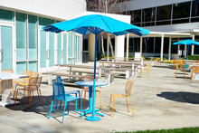 Tables And Chairs In The Sunshine At A Corporate Office Part Outdoor Dining Area