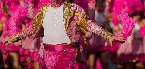 Poster - A man in costume dancing on carnival