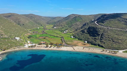 Aerial drone photo of iconic two sided sandy tropical turquoise sea paradise beach of Apokrisi near Fykiada in island of Kythnos at spring, Cyclades, Greece