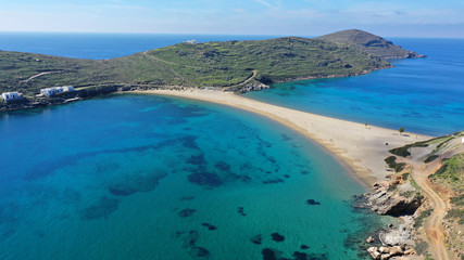 Aerial drone panoramic photo of iconic two sided sandy tropical turquoise sea paradise beach of Kolones near Fykiada in island of Kythnos at spring, Cyclades, Greece