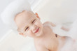 happy funny baby laughing and bathed in the bath