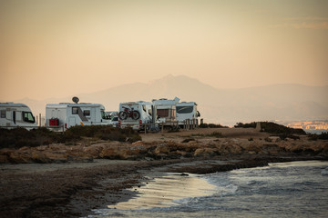 motorhomes parked on the seafront on a trip to paradisiacal destination