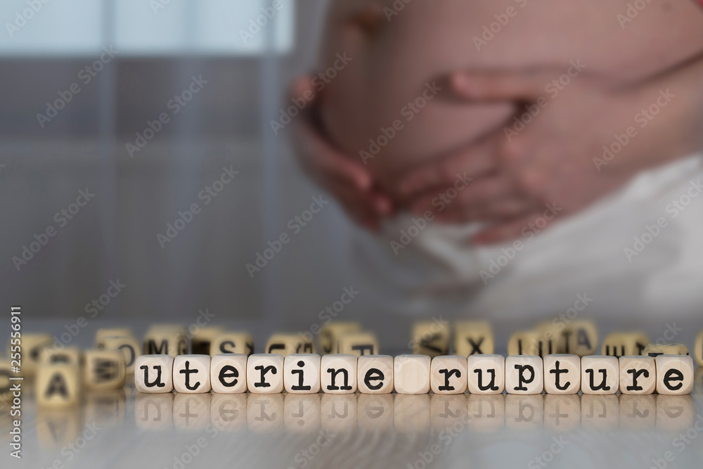 Words UTERINE RUPTURE composed of wooden letters. Stock Photo | Adobe Stock