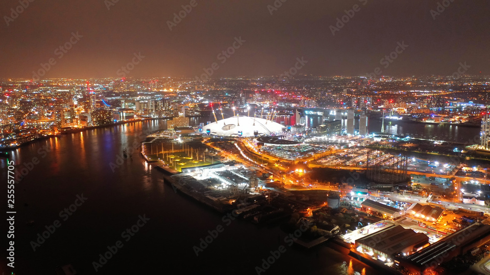 Aerial night shot from iconic public O2 Arena in Greenwich Peninsula, London, United Kingdom - obrazy, fototapety, plakaty 