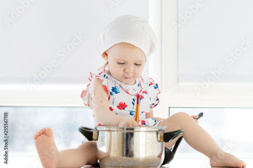 Little Cute Girl Playing In Kitchen With Pots Baby In Kitchen Newborn Baby Concept For Job Career Occupation And Dream Food Cooking Bread And Bakery Concept Stock Photo Adobe Stock