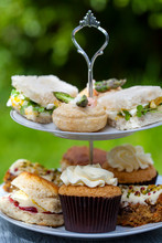 Afternoon Tea With Sandwiches And Cakes