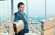 © Nomad_Soul - Young businessman holding out a wad of money
