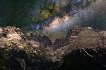 Wall Mural - milky way over the mountains. the dolomites in modonna di campiglio, italy.