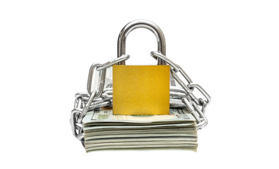 Stack of money wrapped by metal chain with padlock on white background.