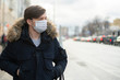 © Mihail - close up man wear cloth mask in the city, polluted air