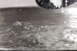 Add salt to boiling water in a metal pan close-up