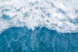 Pale blue sea wave during high summer tide, abstract ocean background