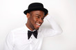 © mimagephotos - Candid portrait of happy man laughing with bowtie and hat