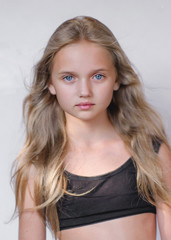 portrait of little model girl in studio