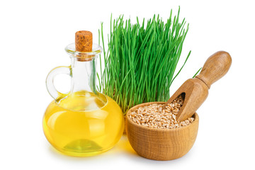 Wall Mural - Wheat green sprouts, wheat seeds in the burlap bag and wheat germ oil isolated on white background