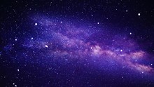 Camera Flying Through A Purple Celestial Nebula Constellation And Star Field In Deep Outer Space.