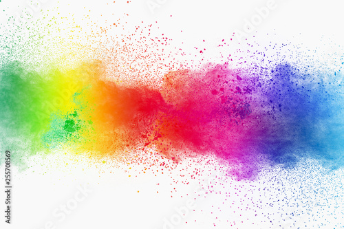 Colorful powder explosion on white background. Pastel color dust particle splashing. © Pattadis