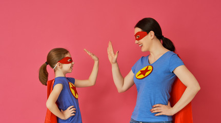 Family in Superhero costumes