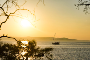 Wall Mural - Marine vessel on the background of a scarlet sunset